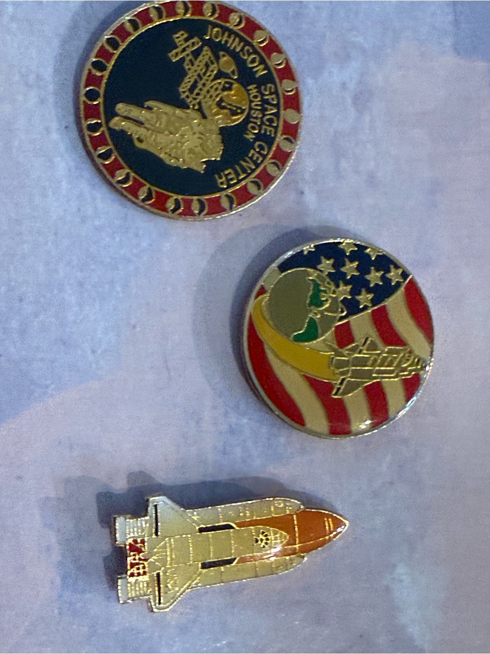 Vintage space-themed collectible lapel pins: Johnson Space Center, shuttle..